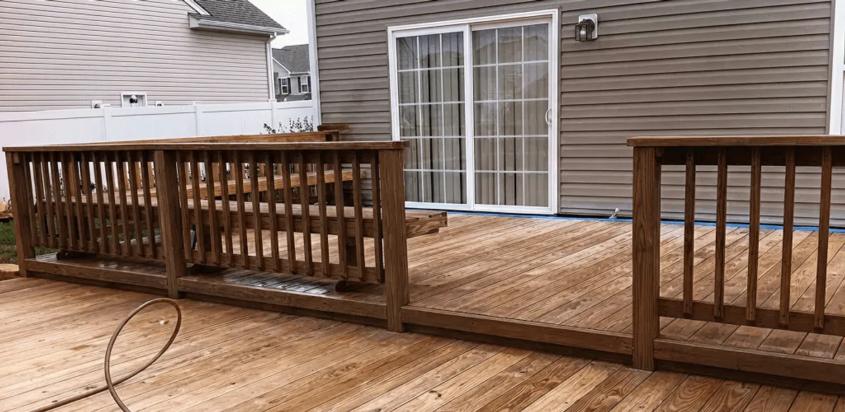 Deck sealing service protecting a backyard wood deck and railings in Gilbert, AZ