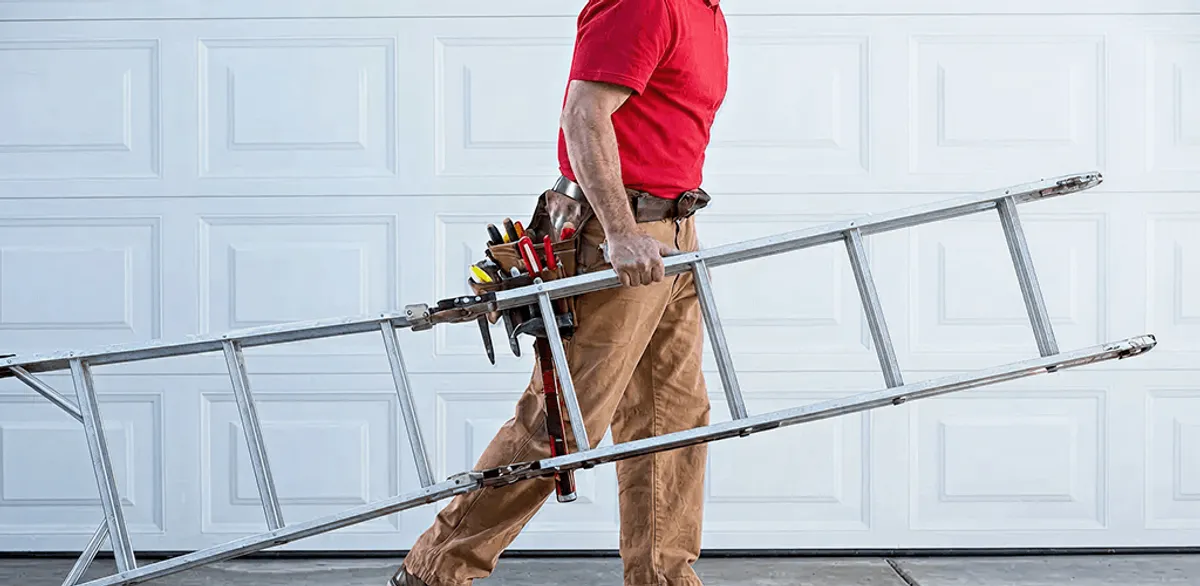 Garage door repair technician arriving with tools and ladder in Gilbert, AZ