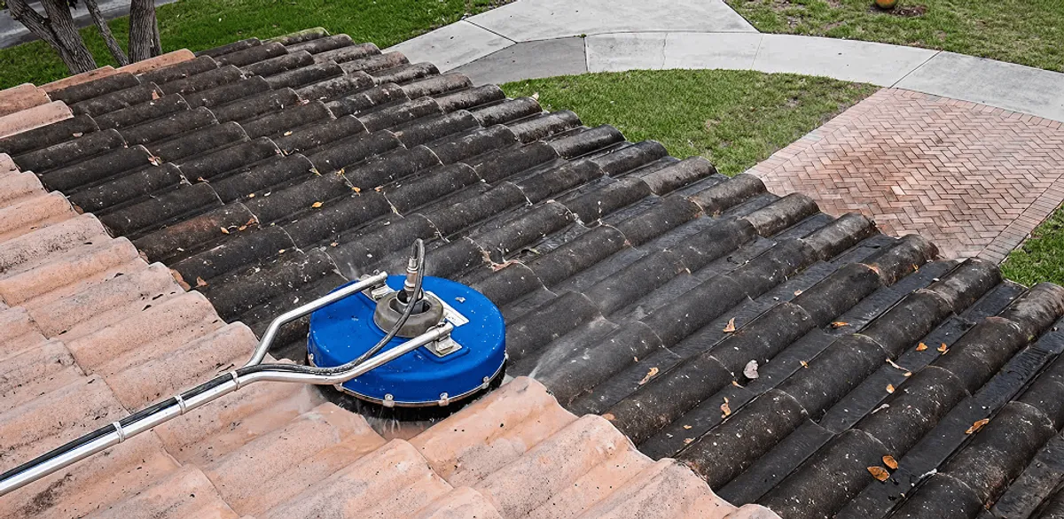 Roof pressure cleaning removing debris and buildup from roof tiles in Gilbert, AZ
